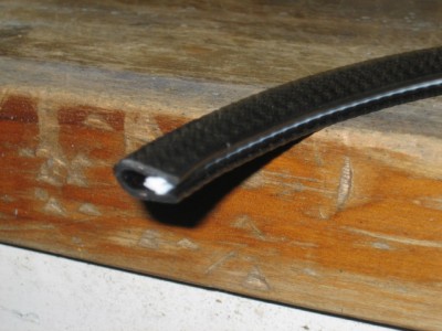 Great discovery - Para Rubber sell this rubber trim with gripping jaws lining the inside. Great for lining jagged holes in panel work!