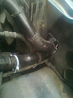 the hole in the front panel beside the radiator i expanded to fit the intercooler pipes
