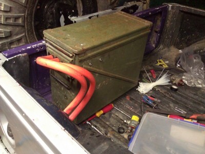 Used a old army ammo box bolted to the tire carrier to hold my battery's