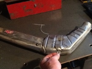 The real problem, the bottom mount has parted company with the exhaust