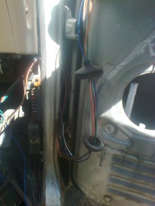 Wiring threaded through car, bungs and door and spaced as needed.